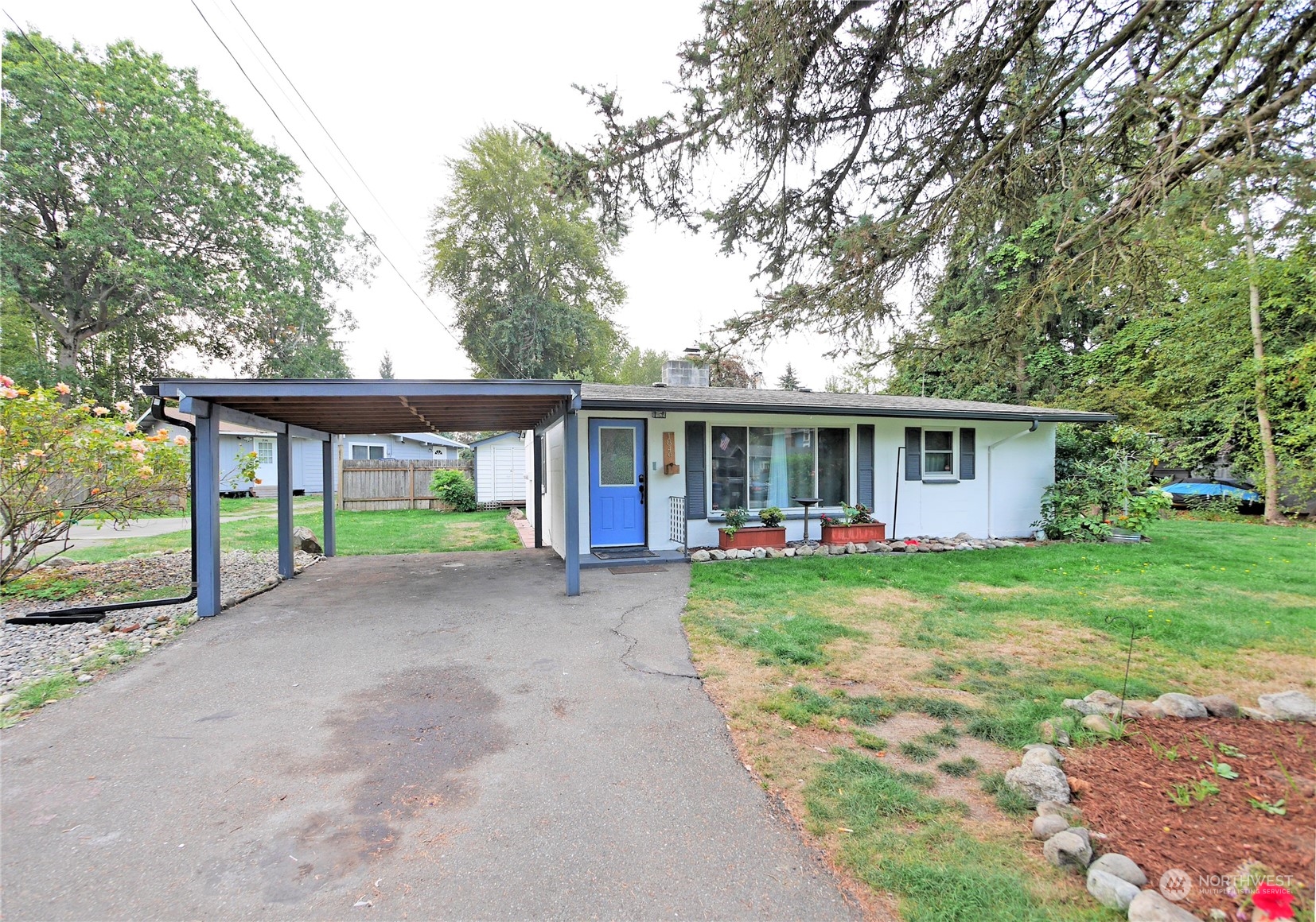 a front view of a house with a yard and porch