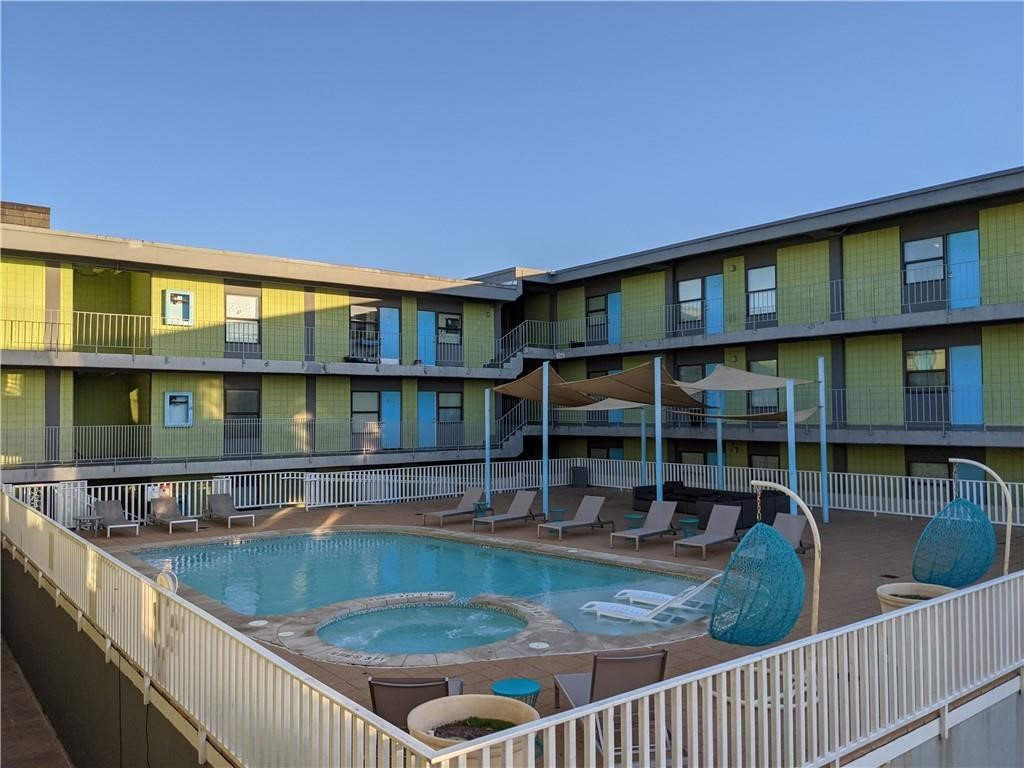 a view of a house with pool from a balcony