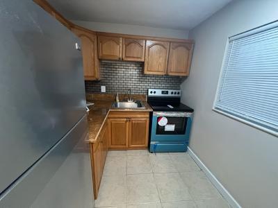 a kitchen with a stove and a refrigerator