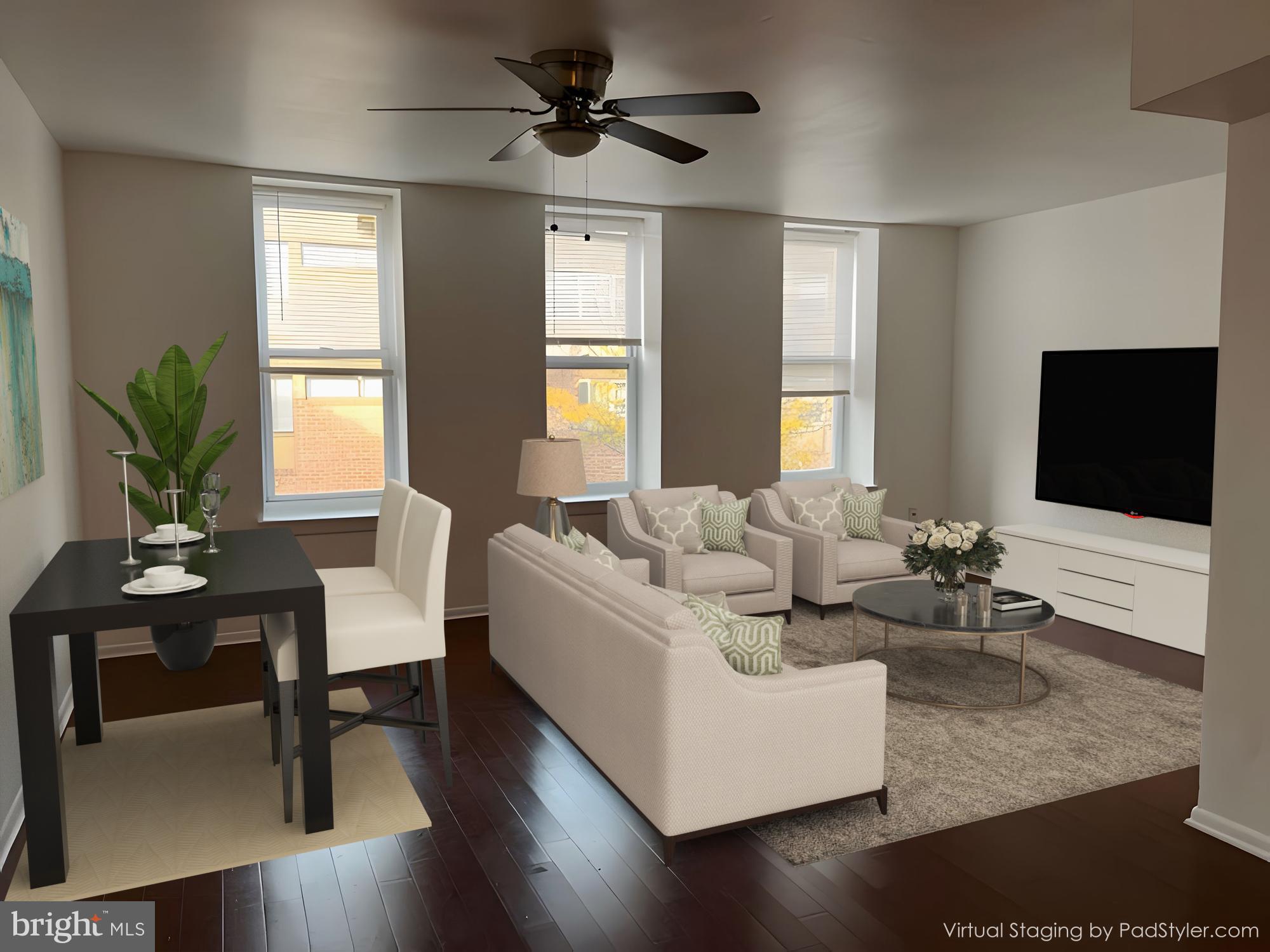 a living room with fireplace furniture and a flat screen tv