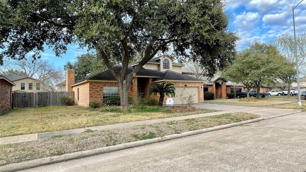 a house that has a tree in front of it