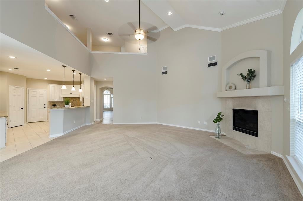 a view of an empty room with a fireplace