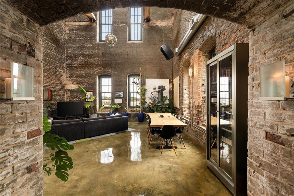 a living room with furniture a rug and a fireplace