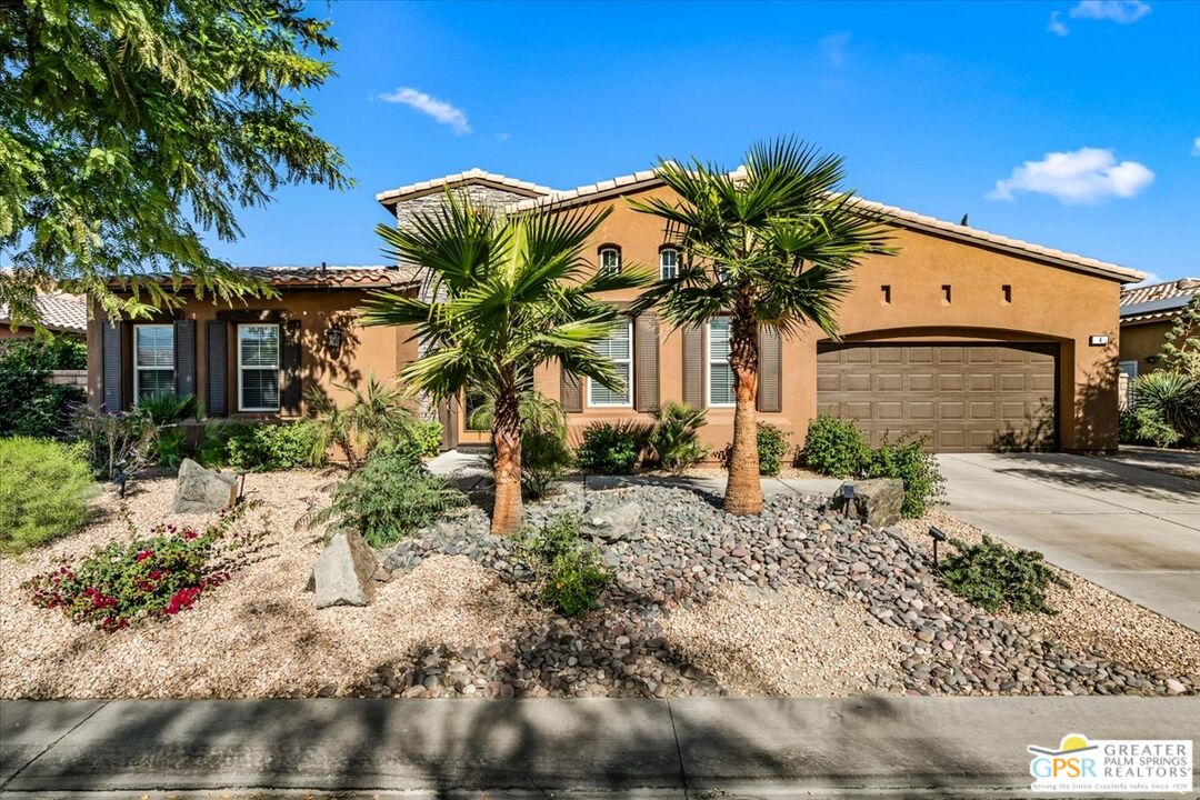 a front view of a house with a big yard