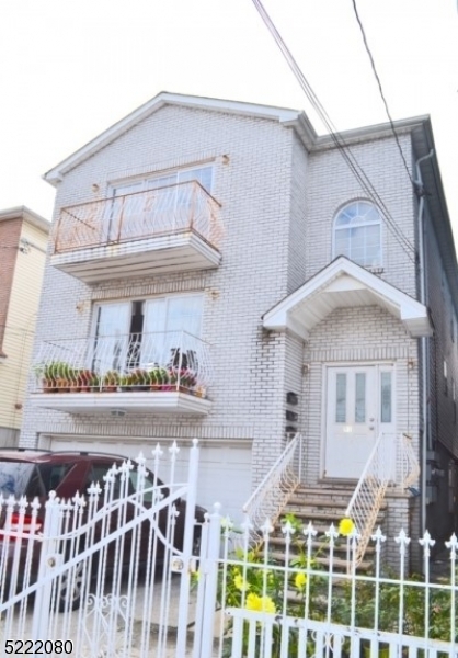 a front view of a house with glass windows