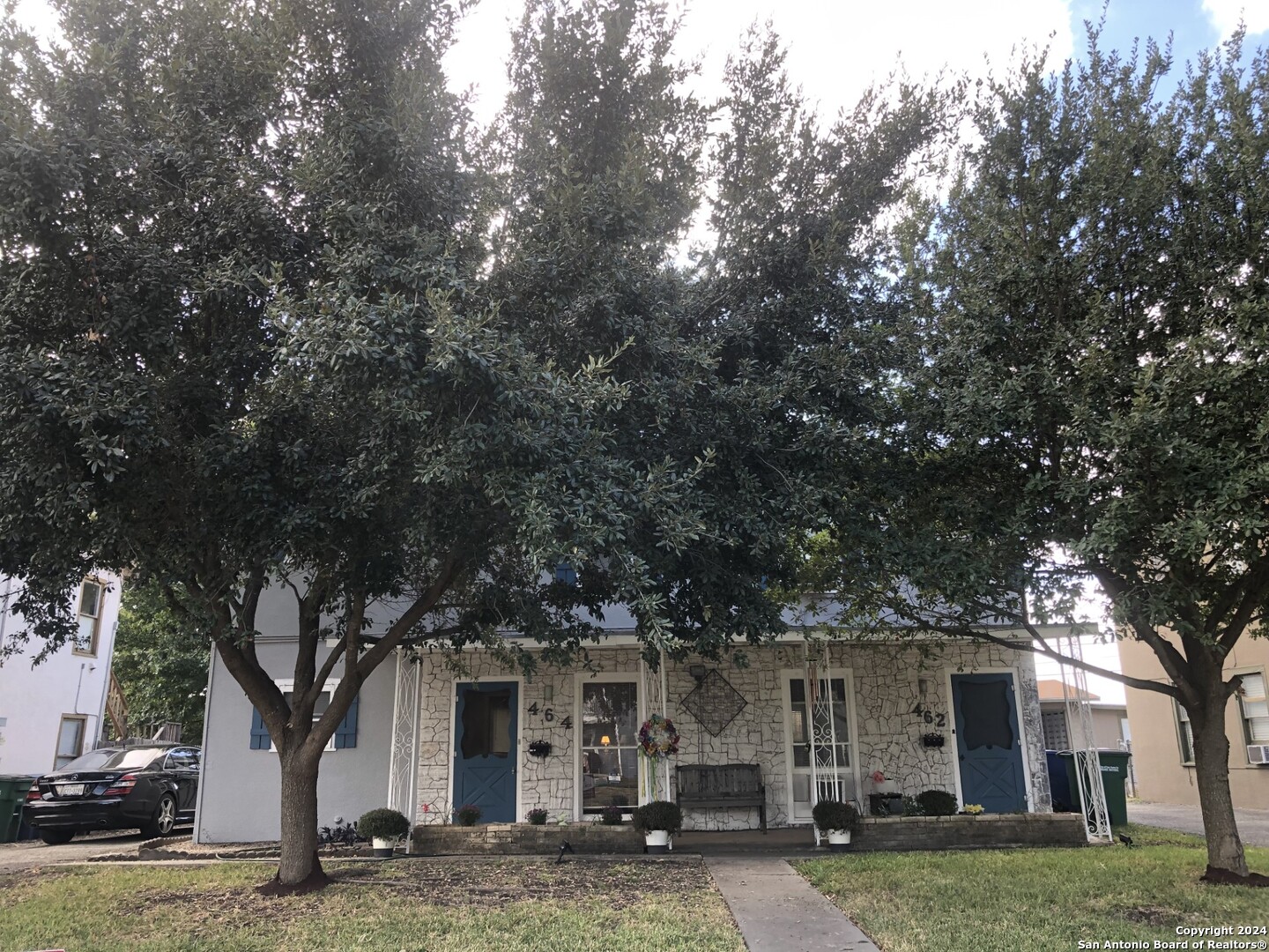 front view of a house with a tree