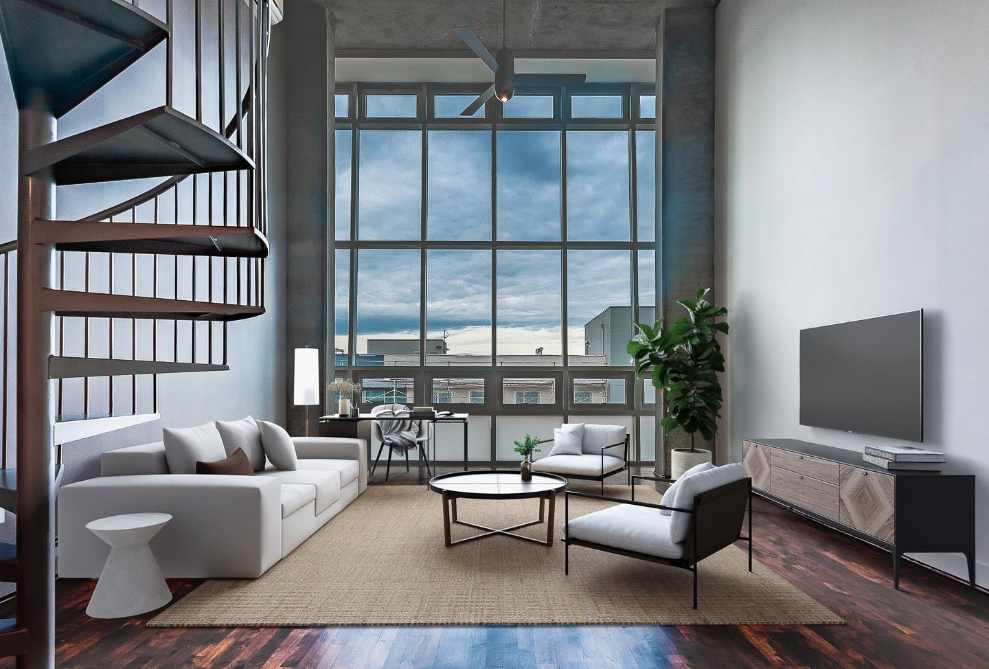 a living room with furniture a rug and a flat screen tv