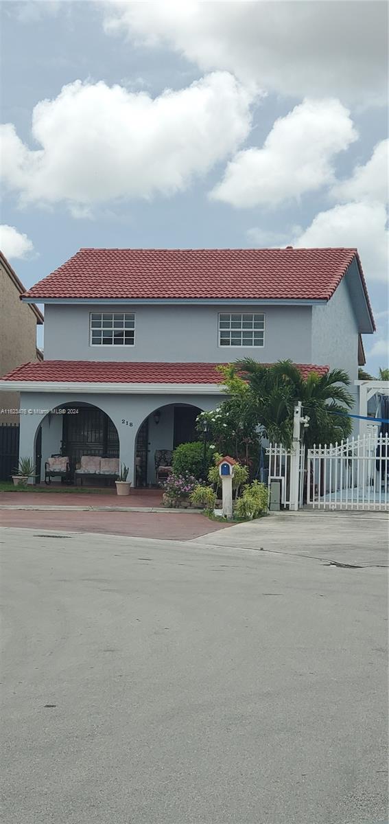 front view of a house with a street