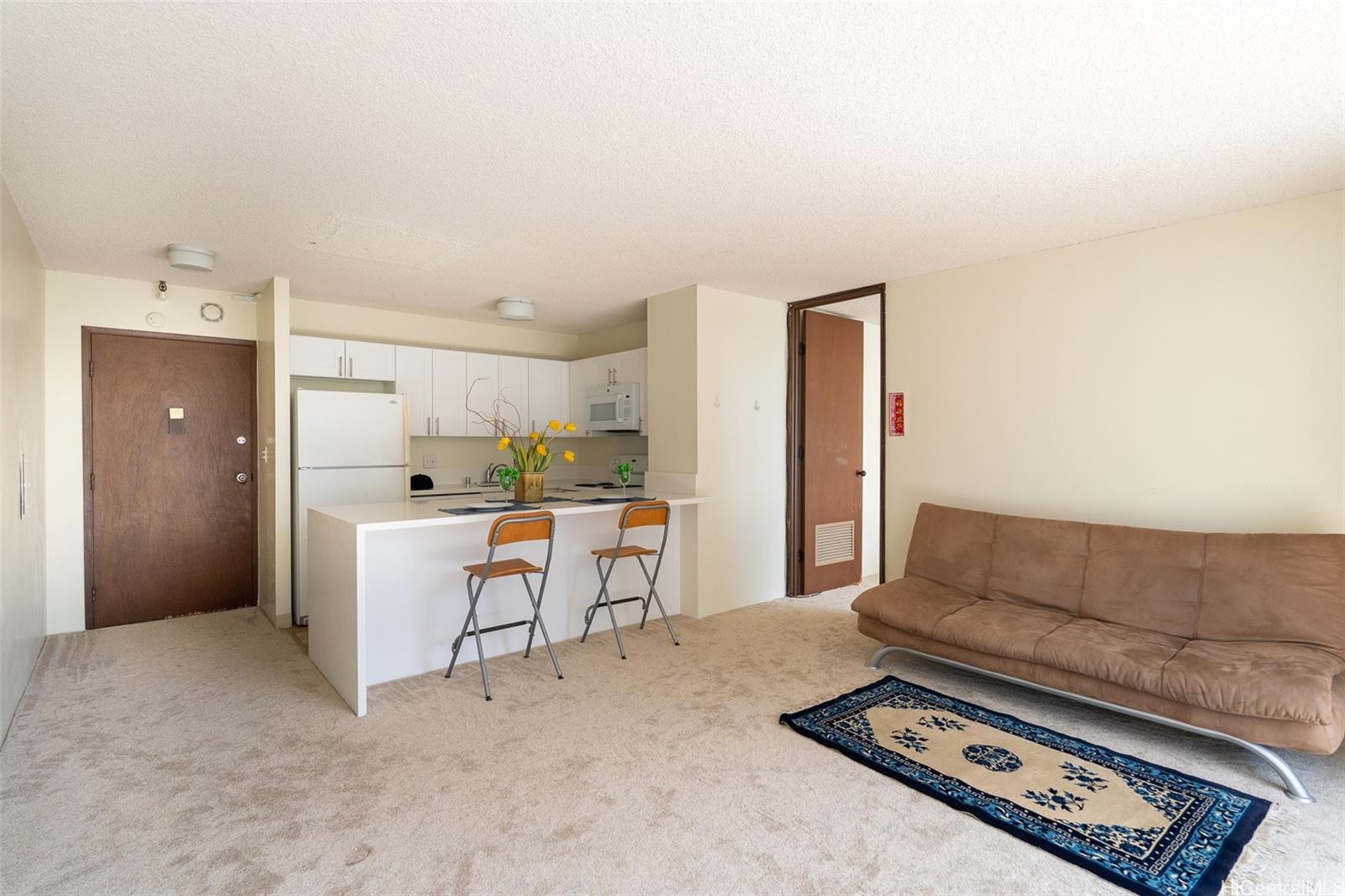 a living room with furniture and a table