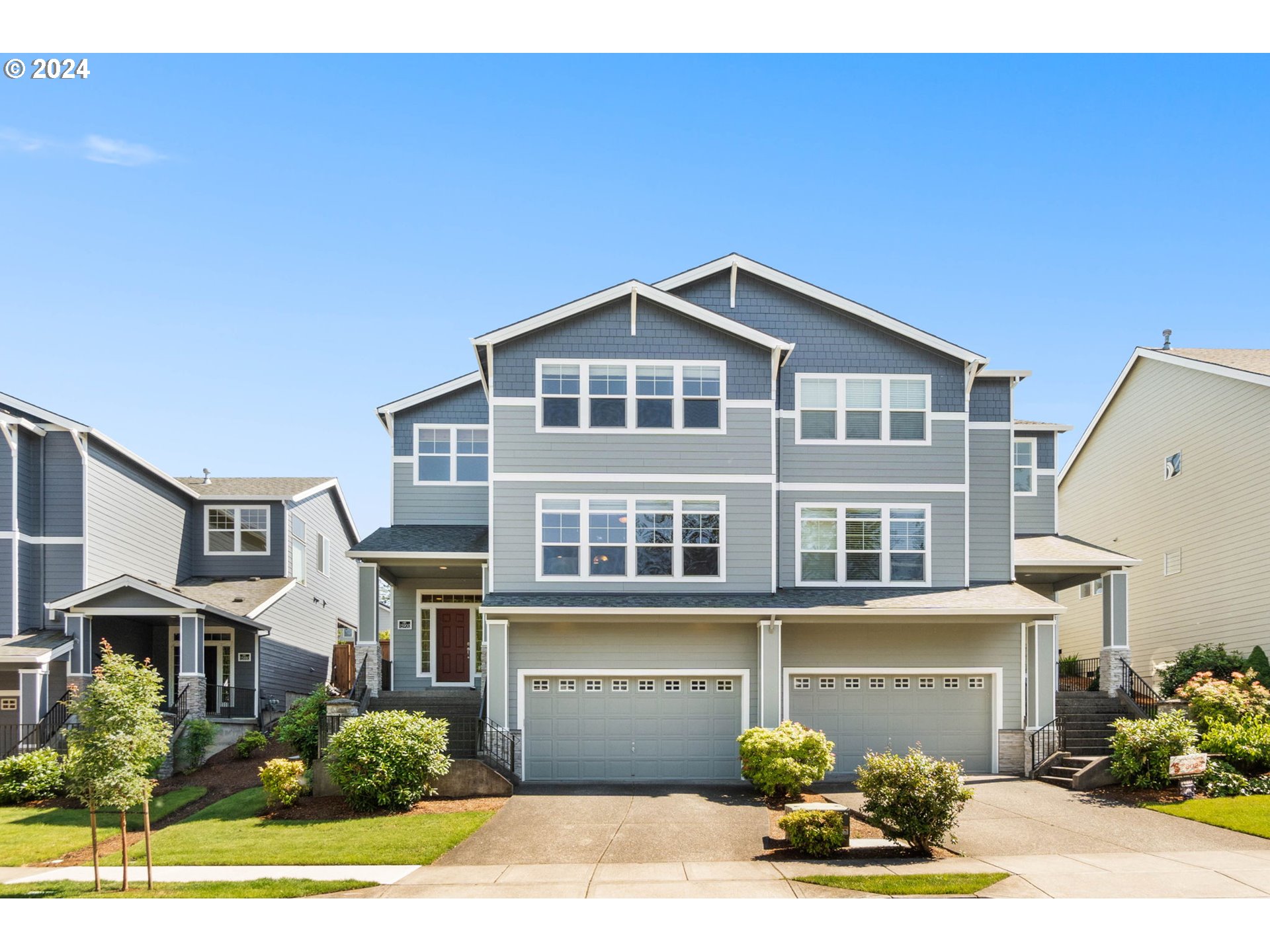 a front view of a house with a yard