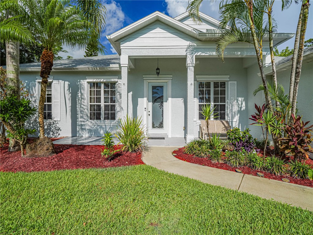 front view of a house with a yard