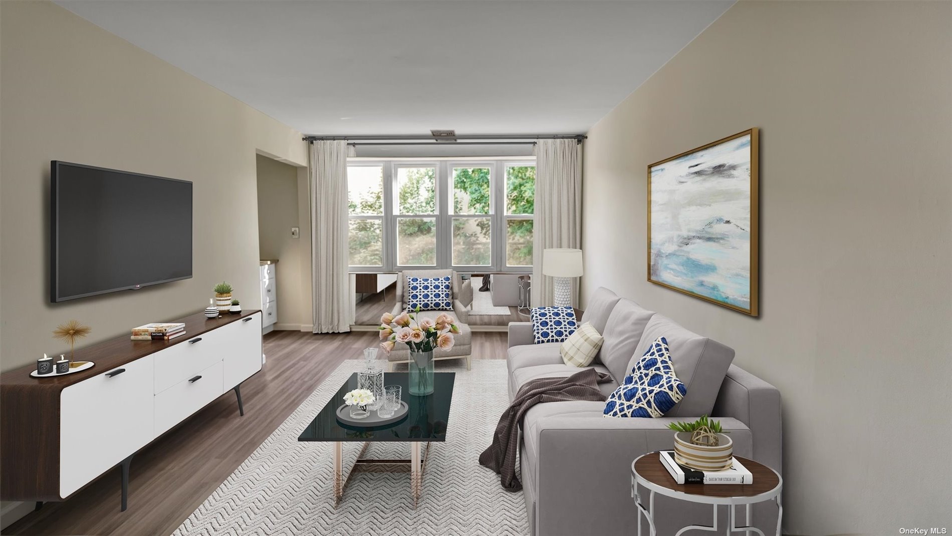 a living room with furniture and a flat screen tv