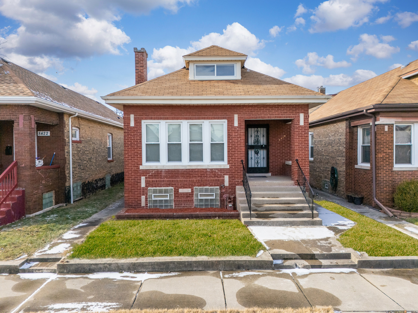 a front view of a house with a yard