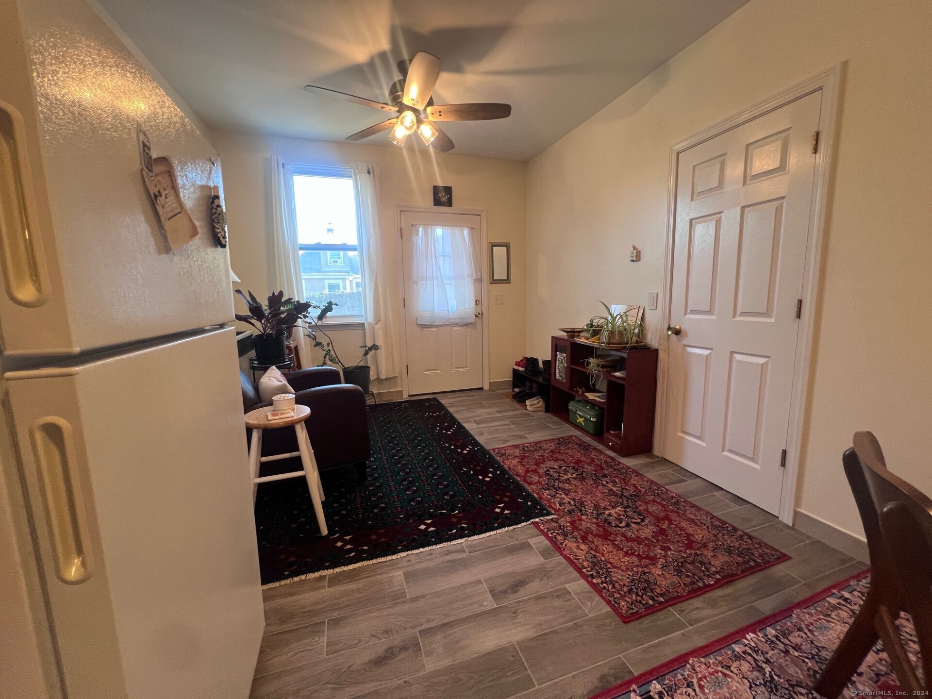 a living room with furniture and a rug