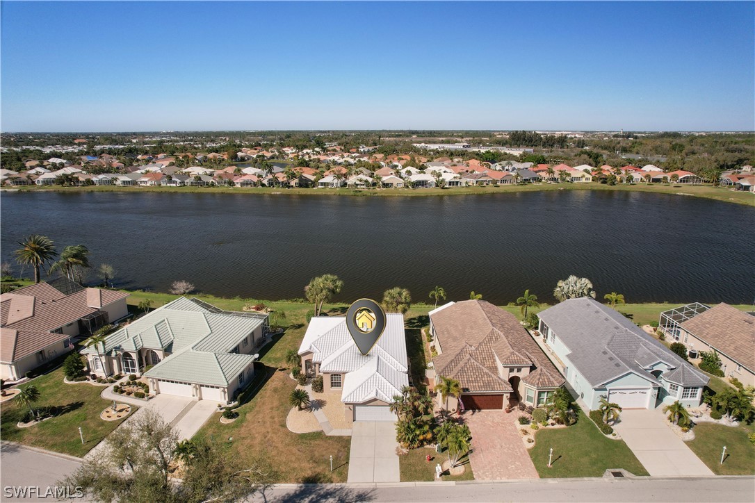 an aerial view of a house with a lake view