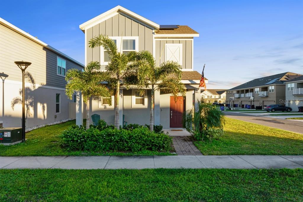 a front view of a house with a yard