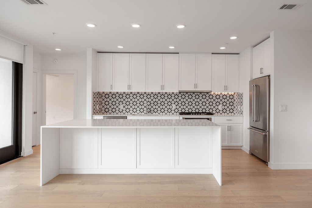 a view of kitchen with a sink wooden floor and kitchen