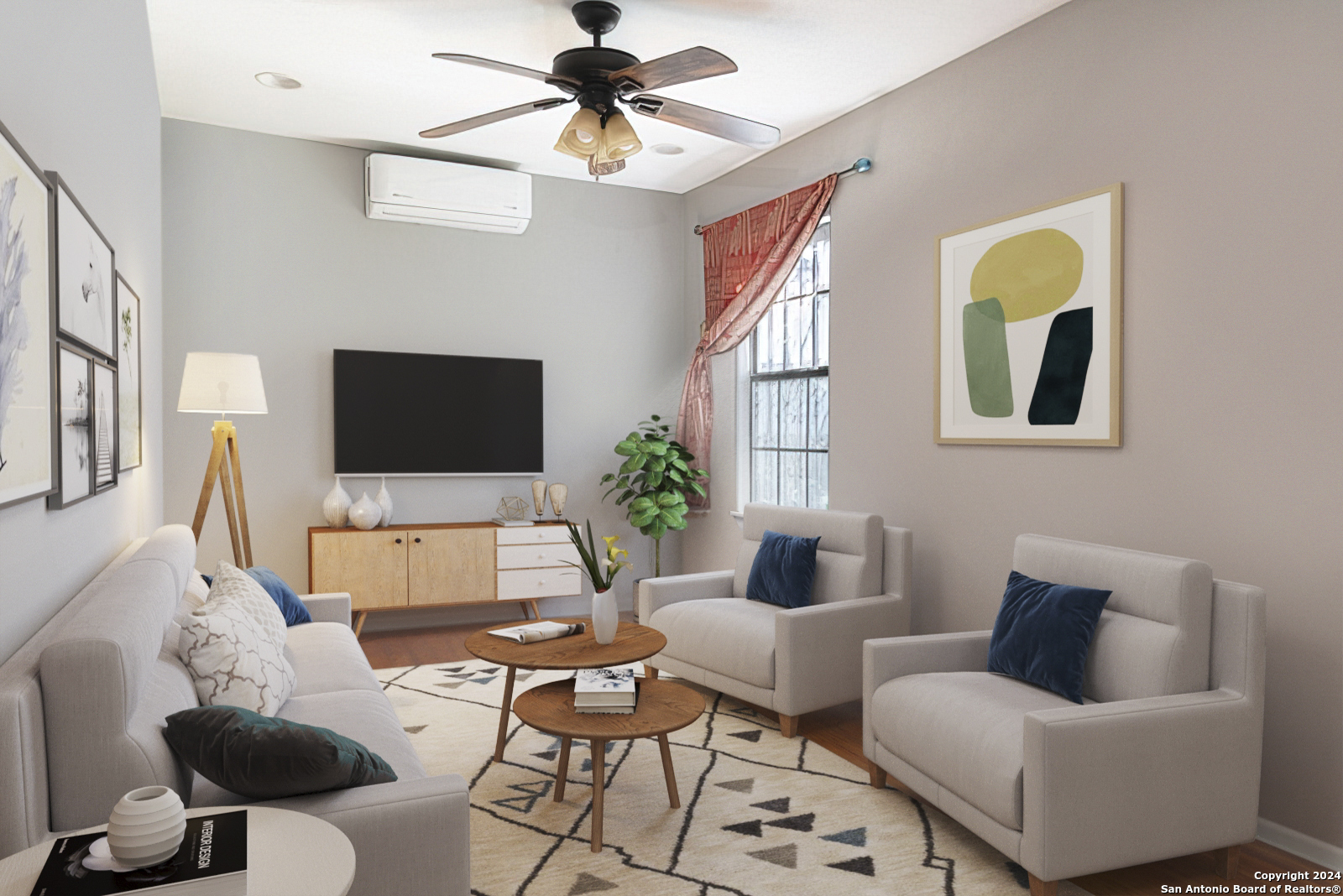 a living room with furniture a flat screen tv and a chandelier