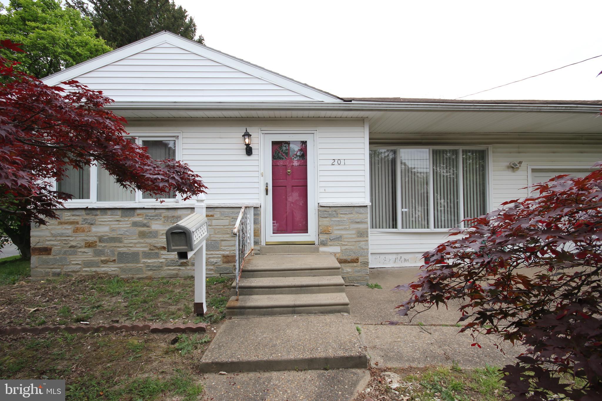 a front view of a house with stairs