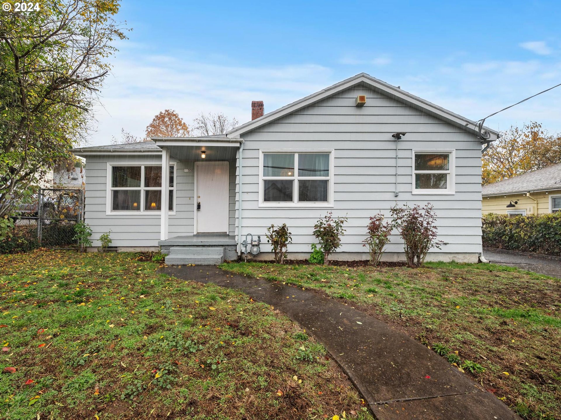 a front view of a house with garden