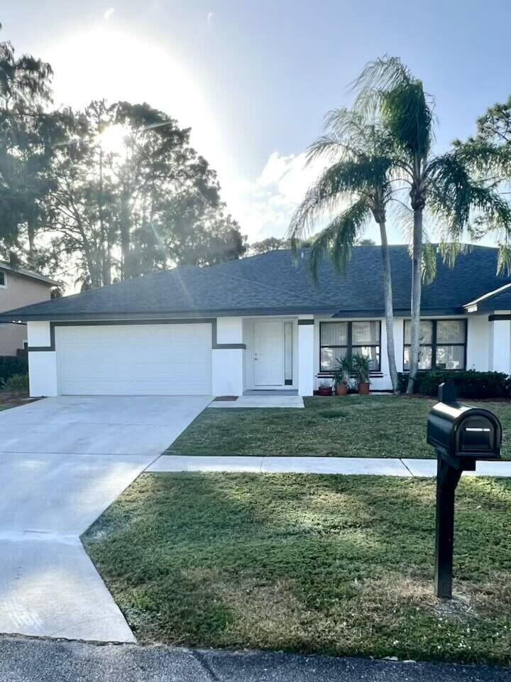 a view of a yard in front of a house