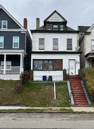 a front view of a house with a yard