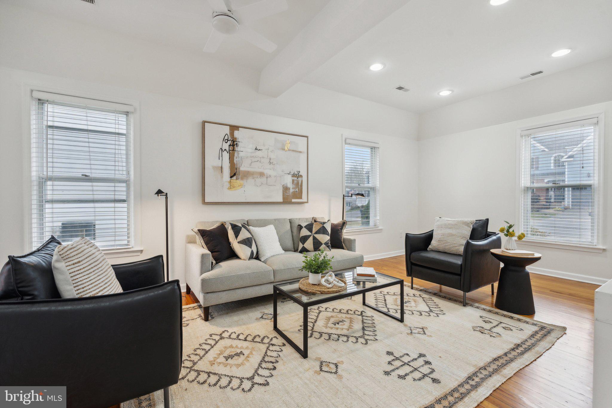 a living room with furniture and a rug