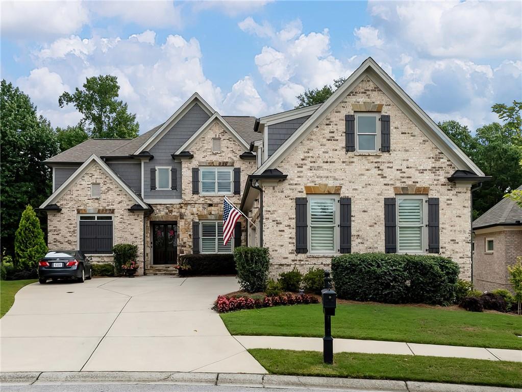 a front view of a house with a yard