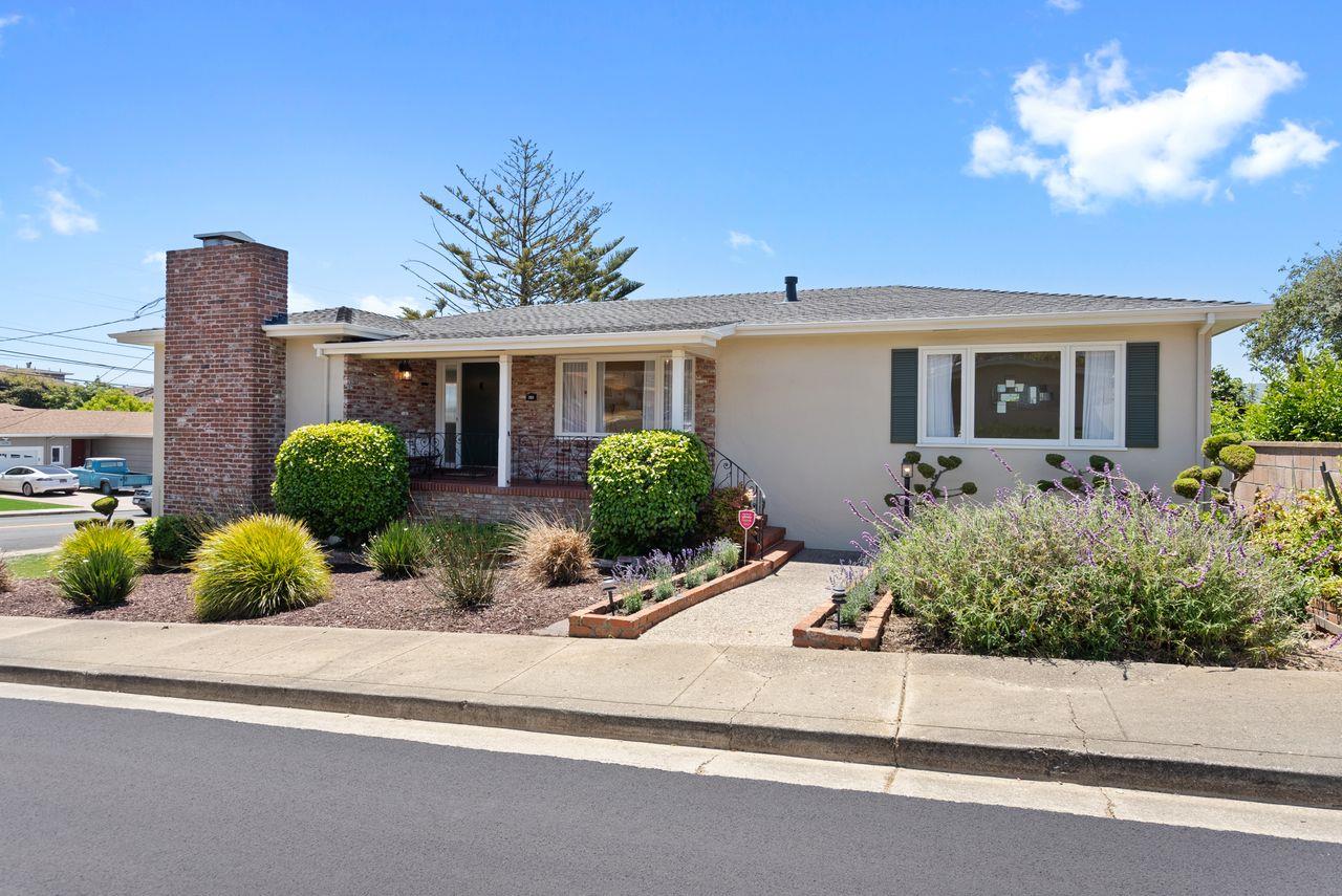 a front view of a house with a yard