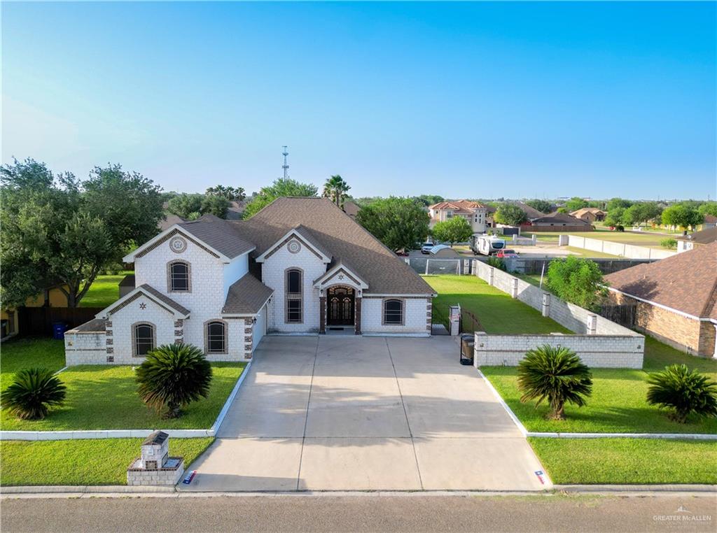 a aerial view of a house with a yard