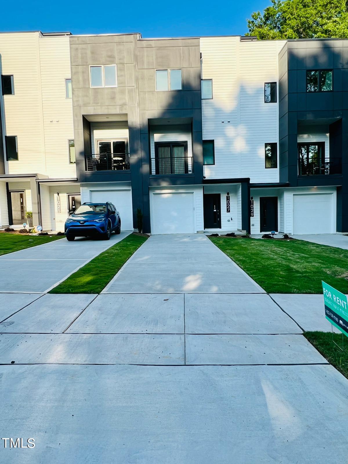 a front view of a building with windows and entertaining space