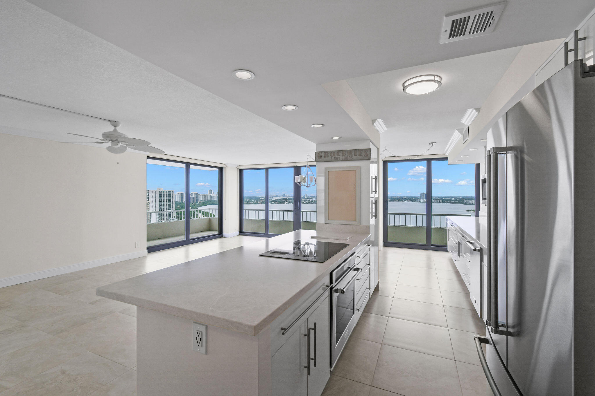 a kitchen with stainless steel appliances granite countertop a refrigerator and a sink