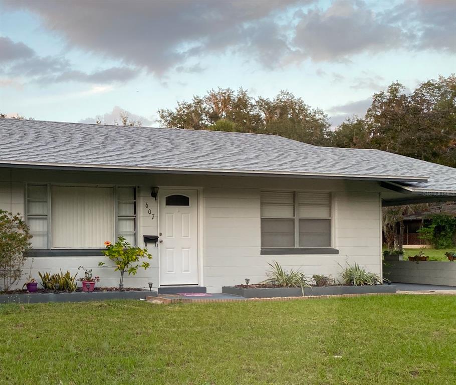 a front view of a house with a yard