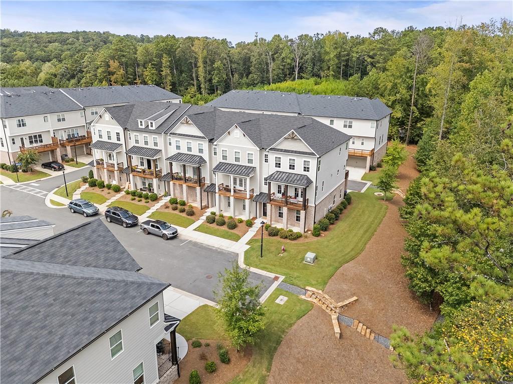 an aerial view of a house with a big yard