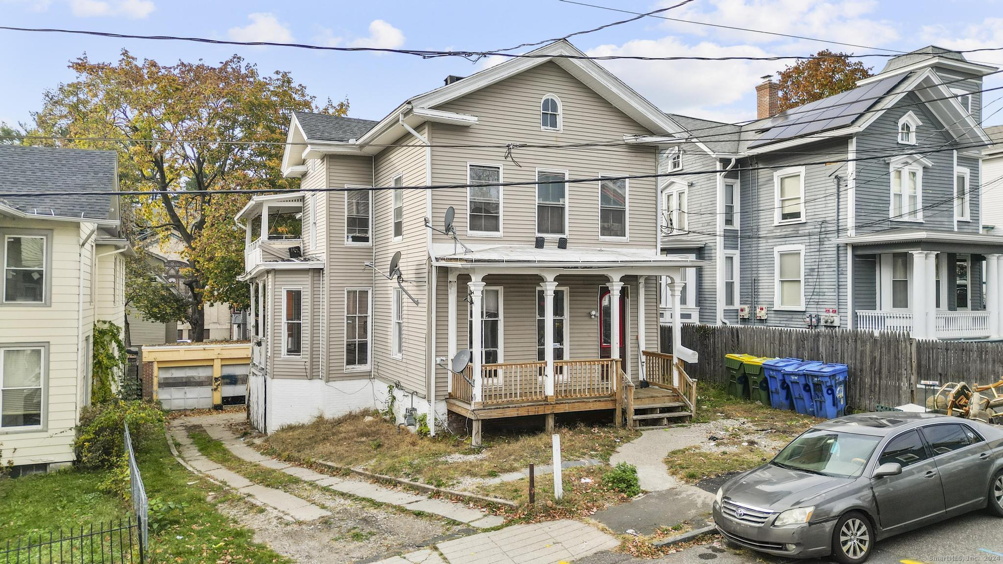 a front view of a house with parking space