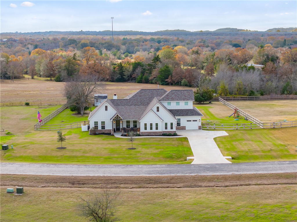 Birds eye view of property featuring a rural view