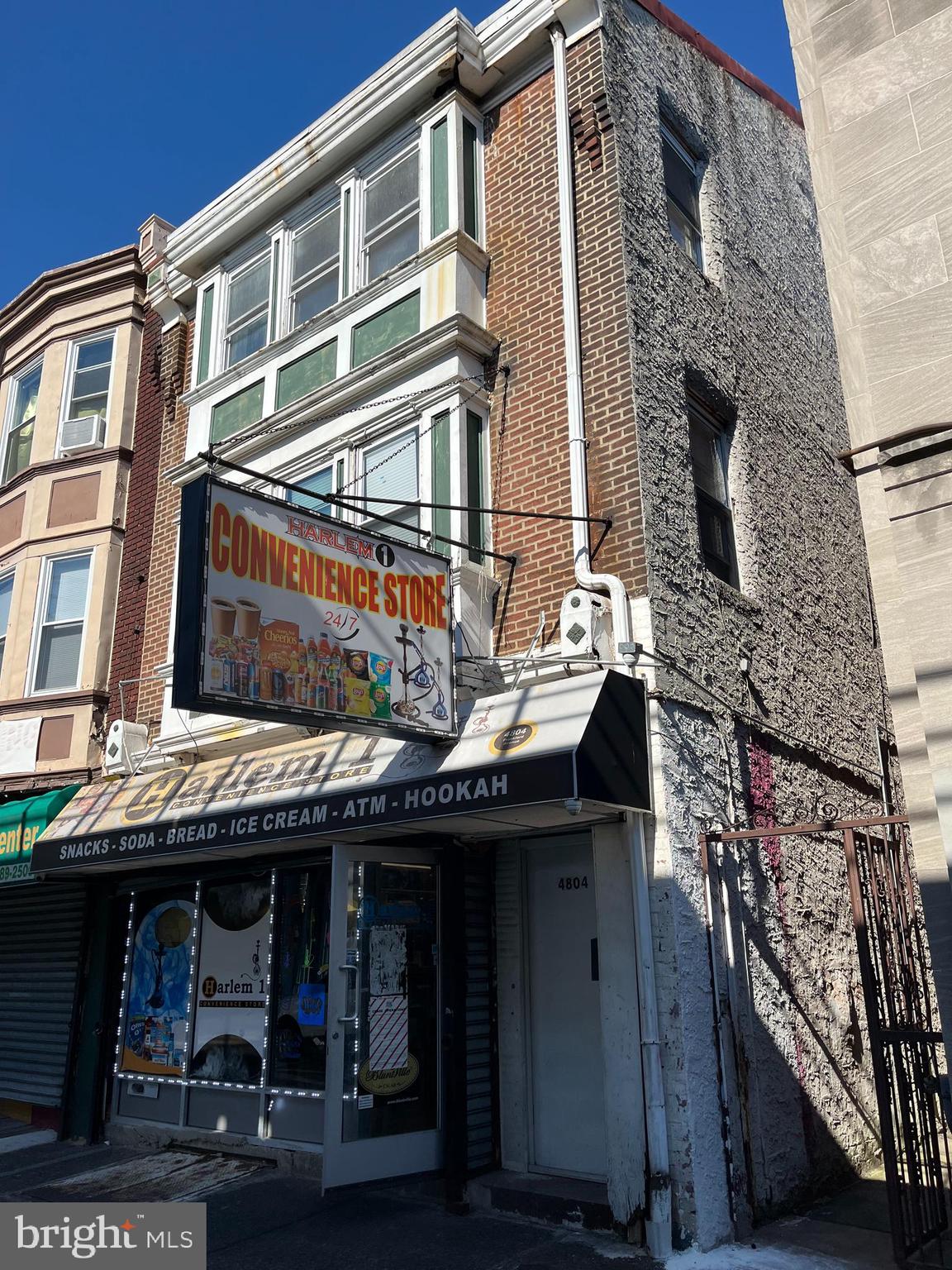 a front view of a building with retail shops