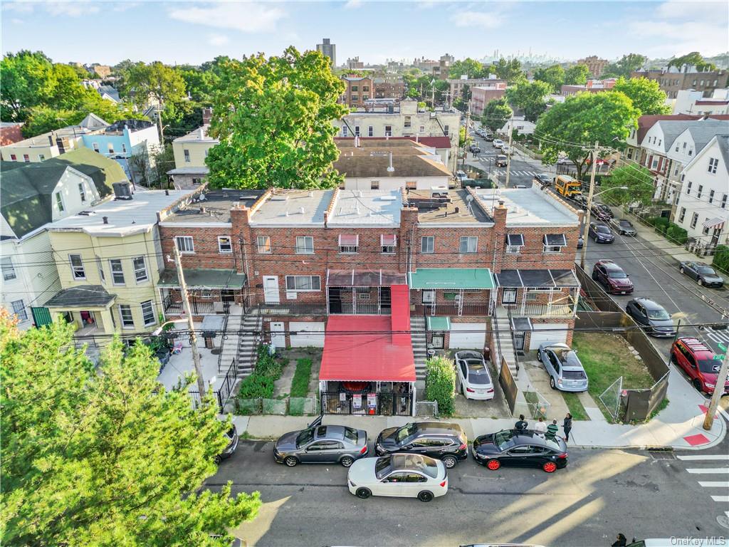 an aerial view of residential houses and car parked on street side