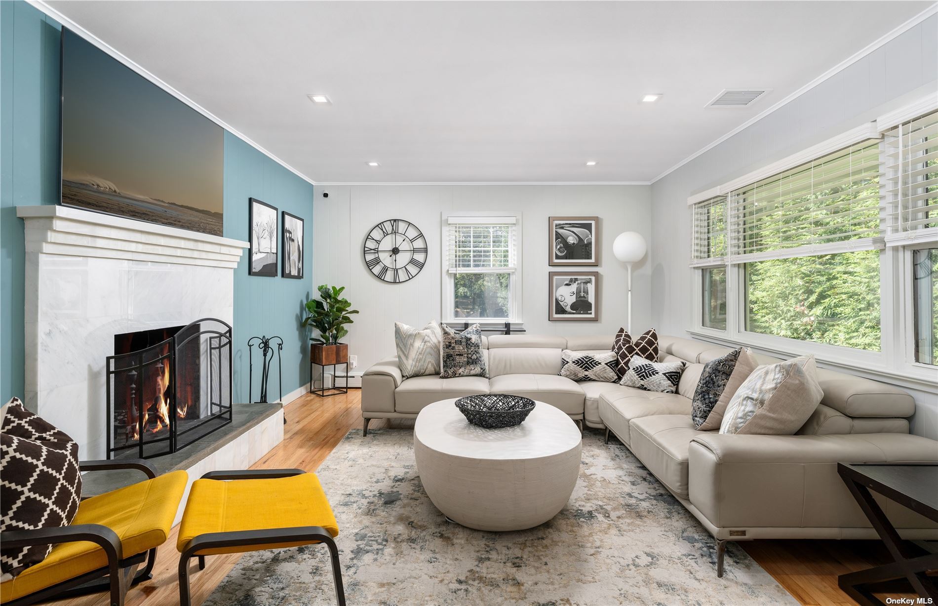 a living room with furniture and a fireplace