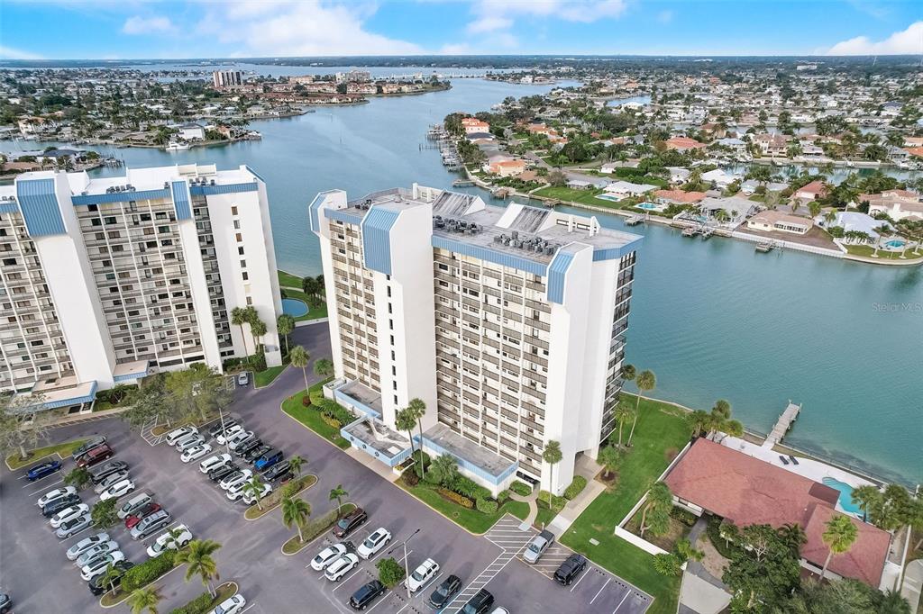 an aerial view of residential building and lake