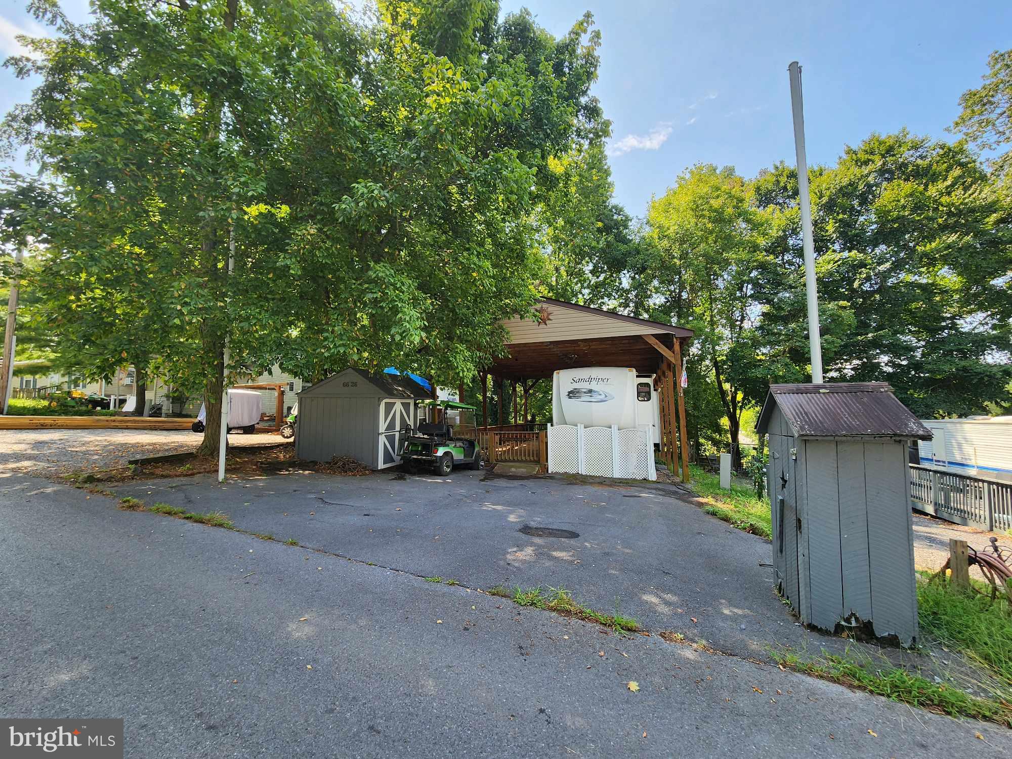 a view of a house with a yard and garage