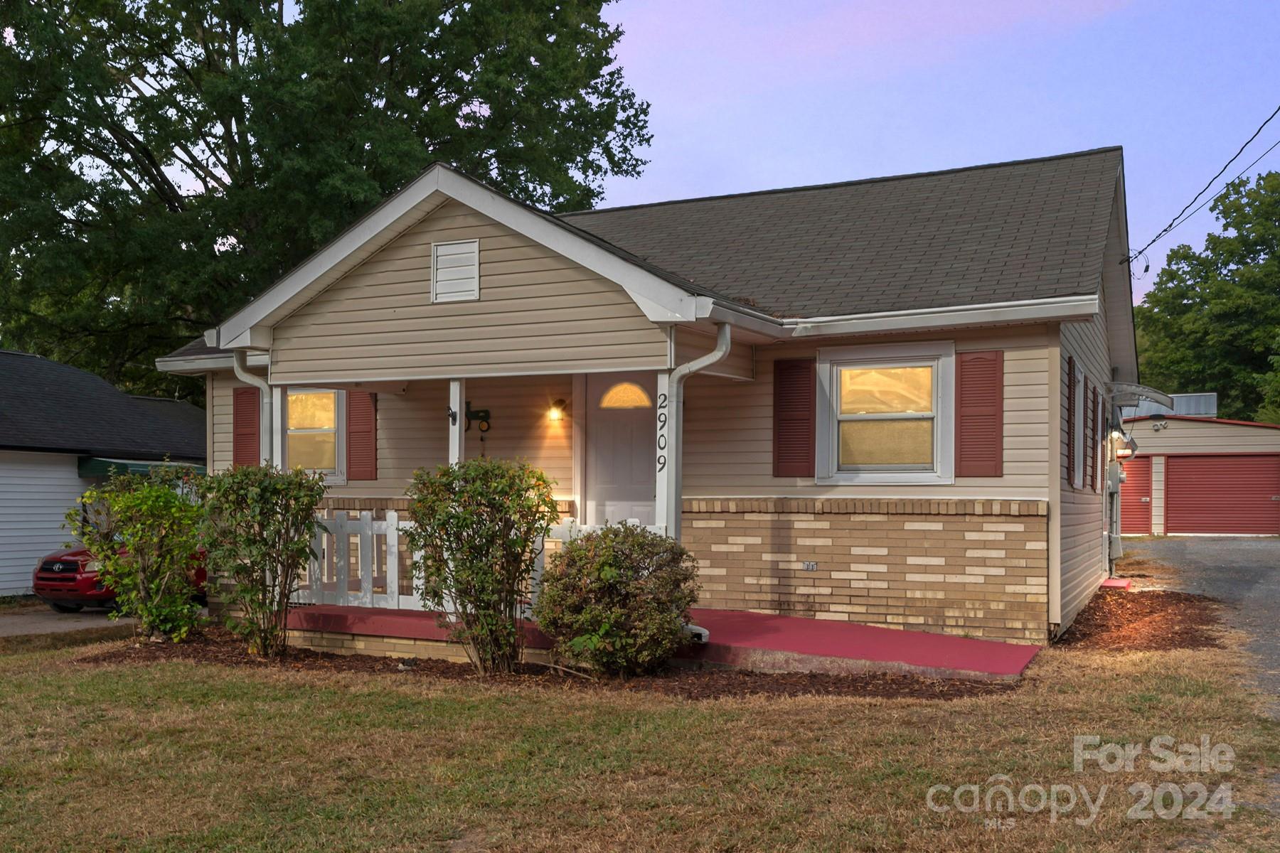 a front view of house with an outdoor space