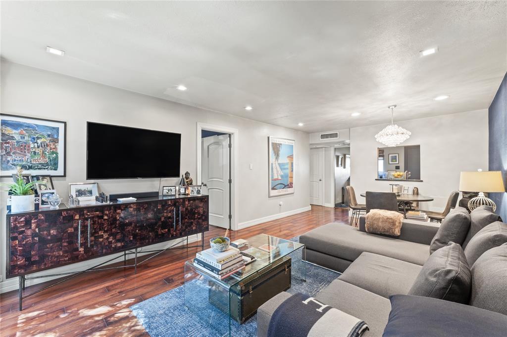 Living room with dark wood-type flooring