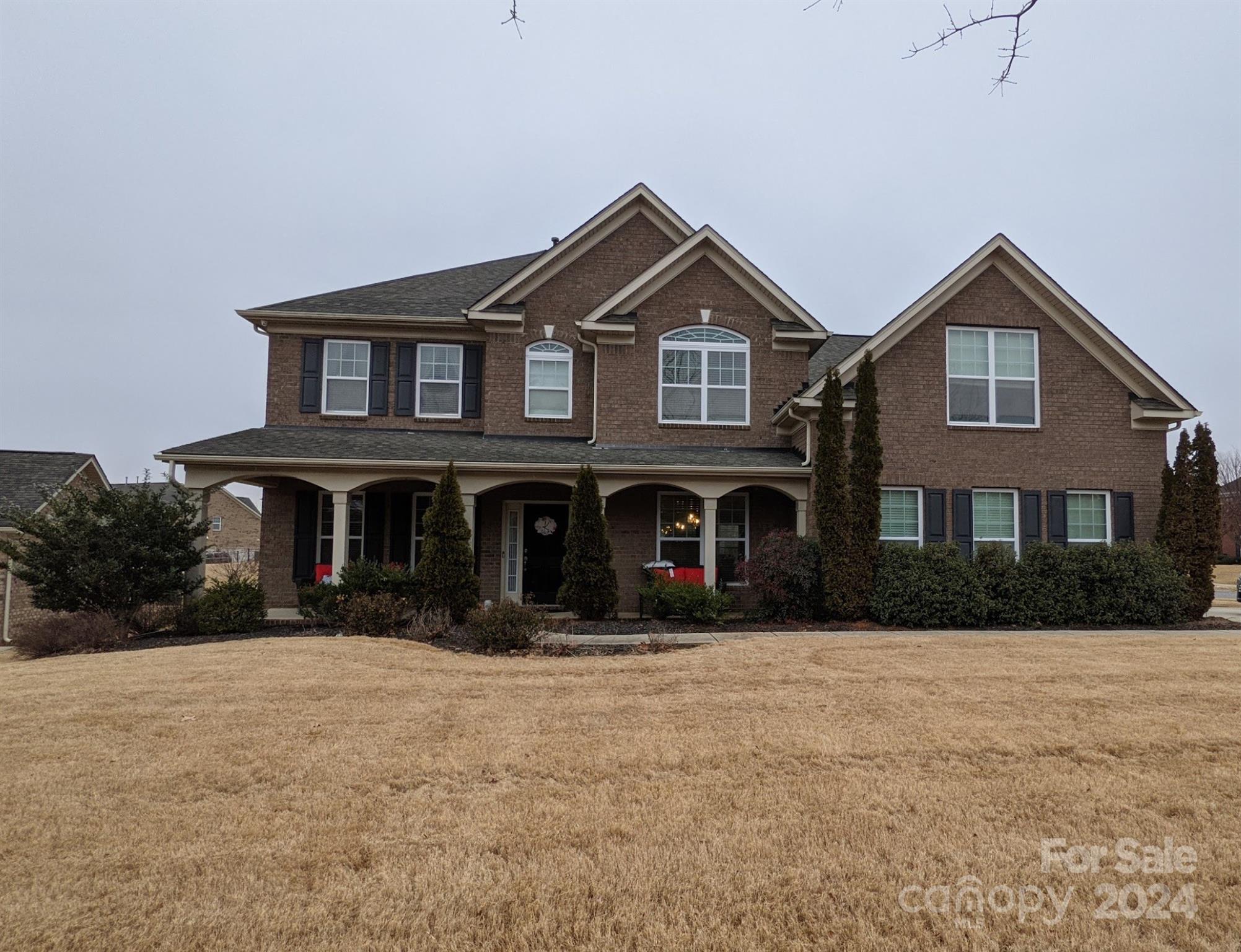 a front view of a house with a yard