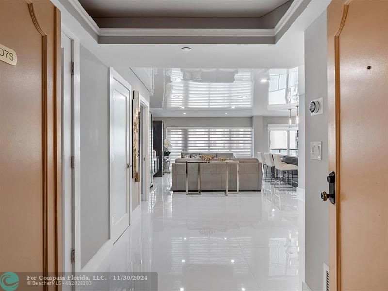 a view of a hallway with a glass door and outer view