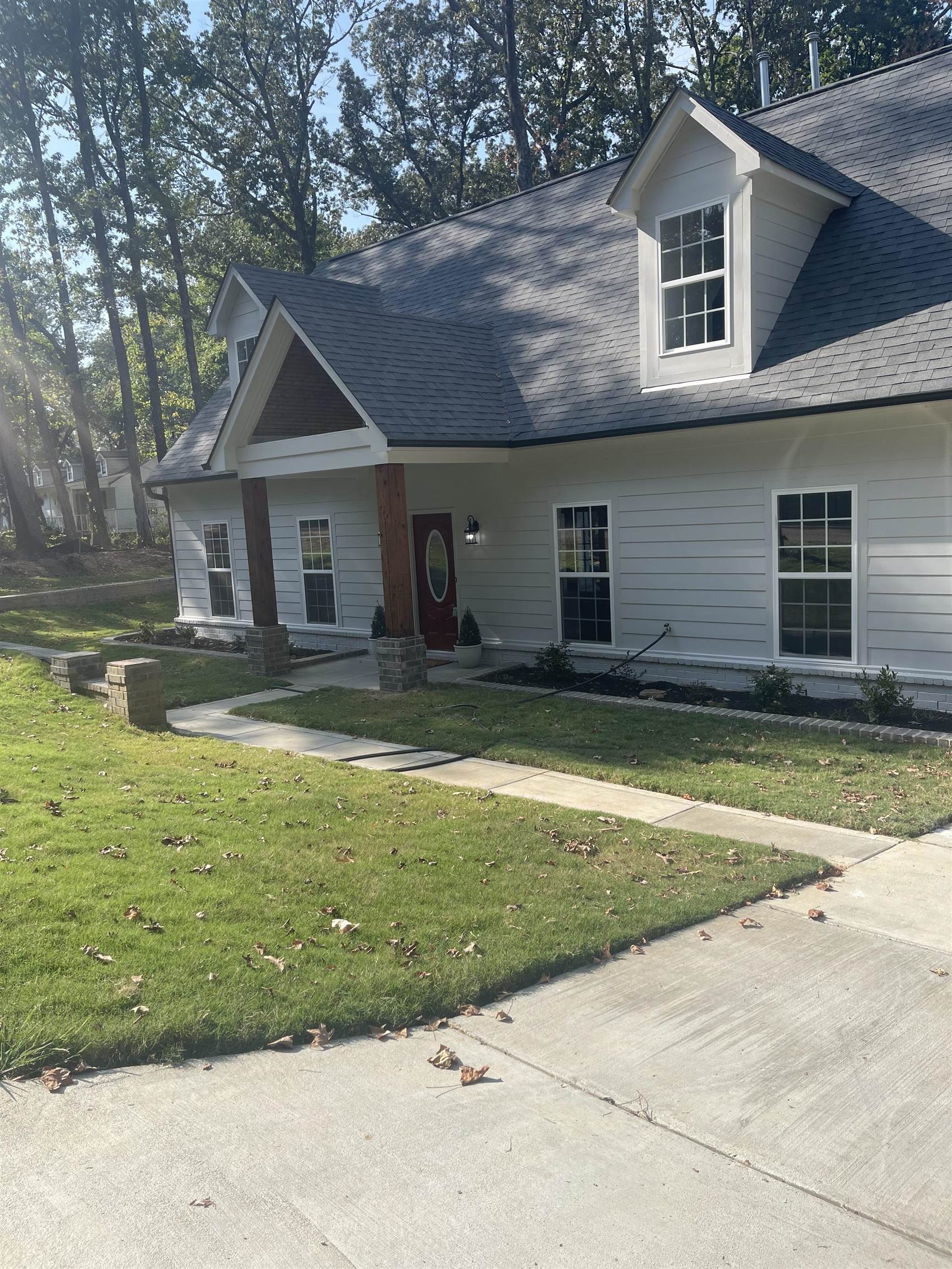 a front view of a house with a yard