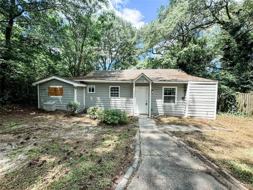 a view of a house with a yard