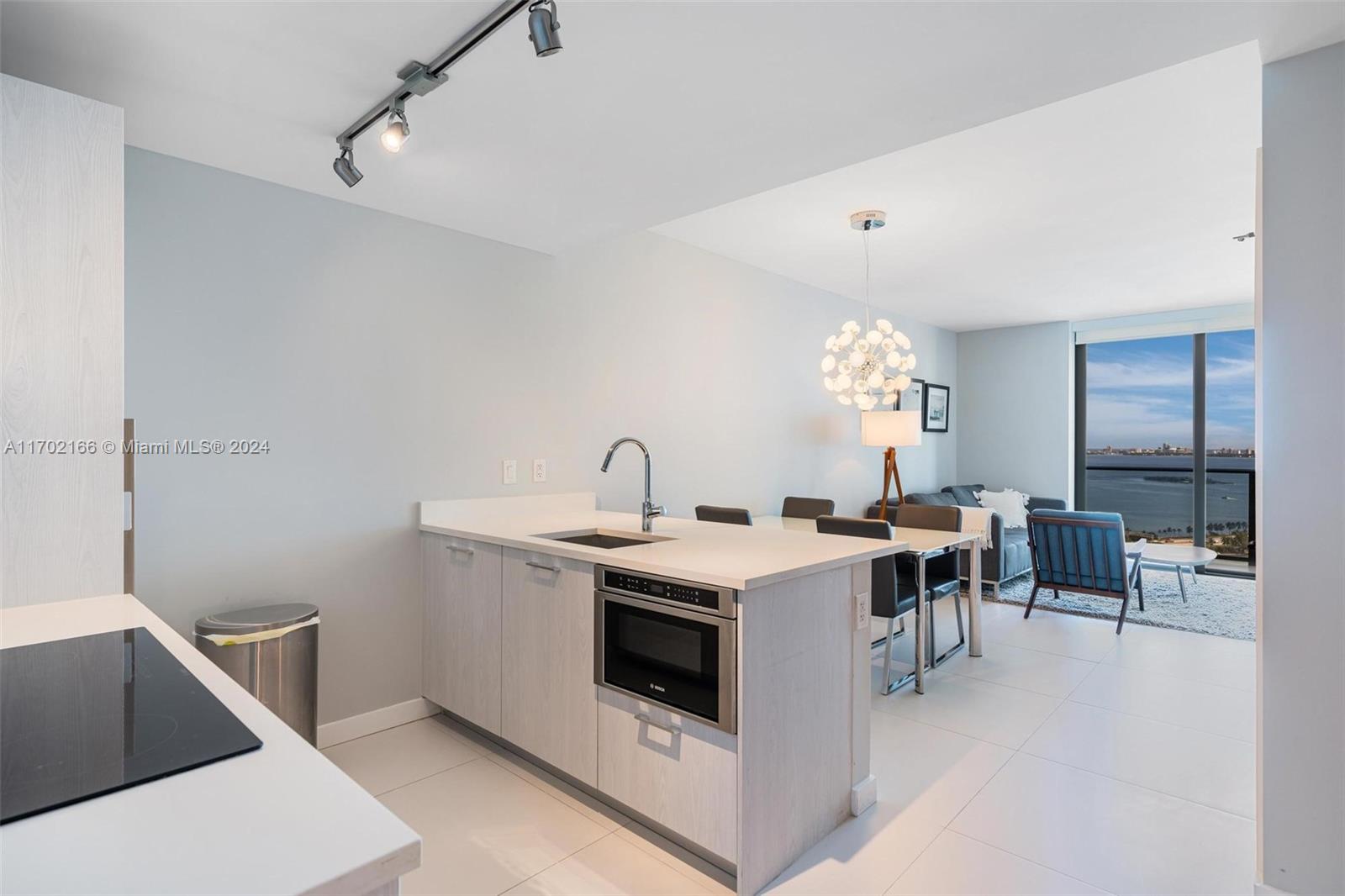 a view of a kitchen area with furniture and windows