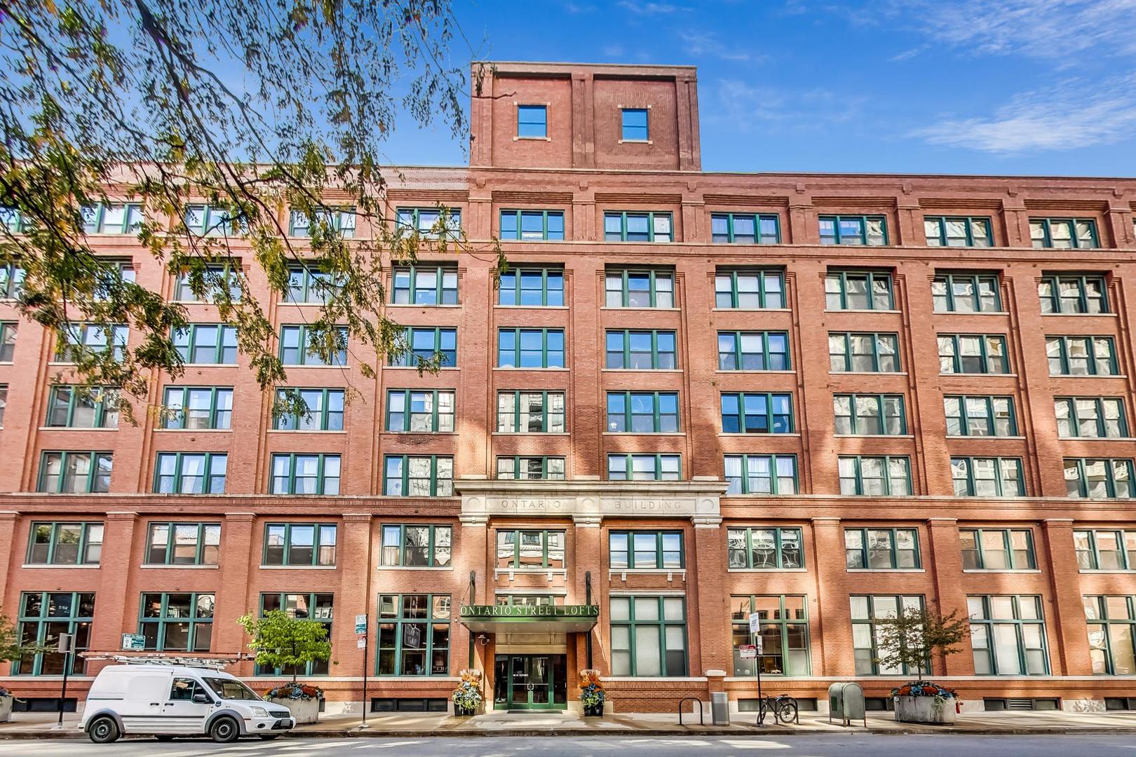 a front view of a building with a lot of windows