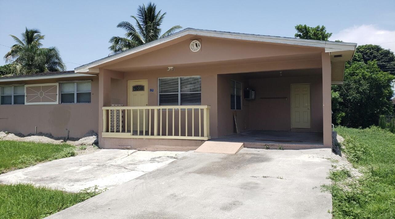 a front view of a house with a porch